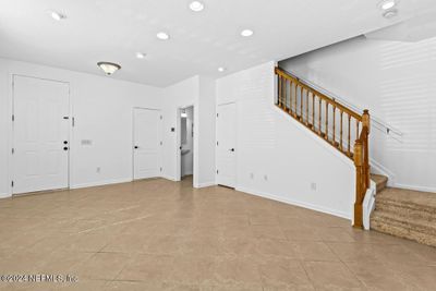 Staurs lead to the upstair bedrooms. This townhome has 3 bedrooms. | Image 3