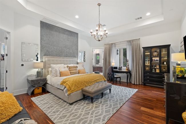 Unwind in a spacious primary suite designed for peace and privacy. | Image 19