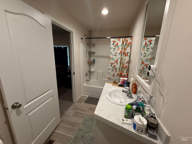 Full bath with vanity and shower / bath combination with curtain | Image 9