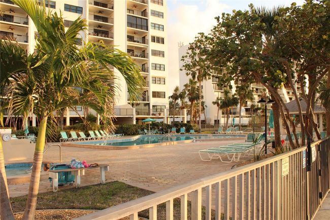 Balcony view of pool and beach | Image 48
