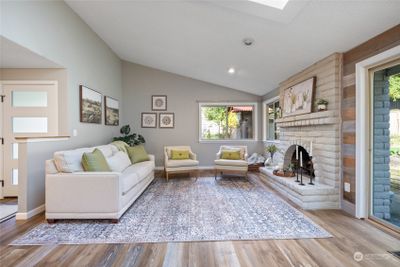 Living Room with a wood burning fireplace | Image 3