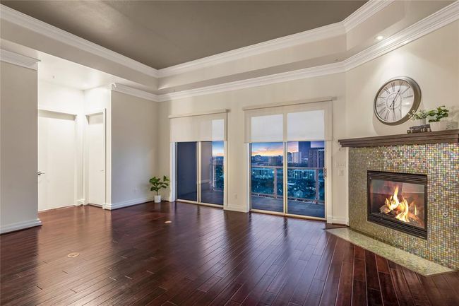 The floors are amazing! To the immediate left is a secondary bedroom with a full bathroom next to it. | Image 8