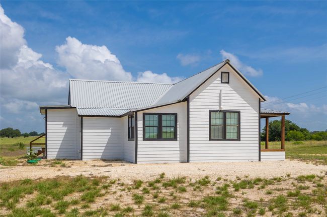 Rear view of property featuring a metal roof | Image 6
