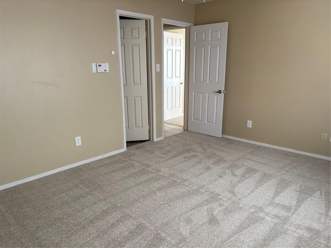 Carpeted spare room with baseboards | Image 14