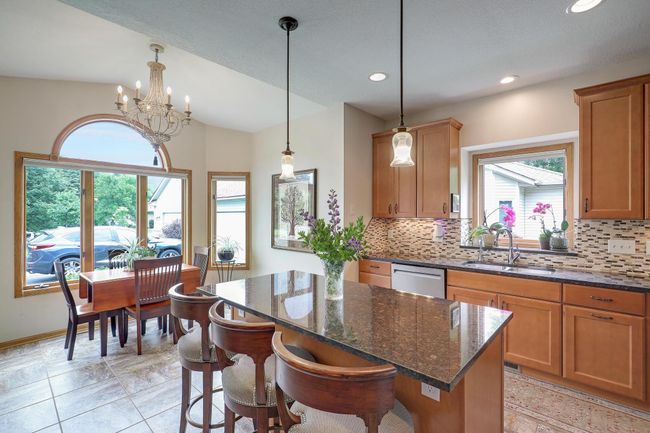 Elegant lighting and a kitchen window for extra light. | Image 15