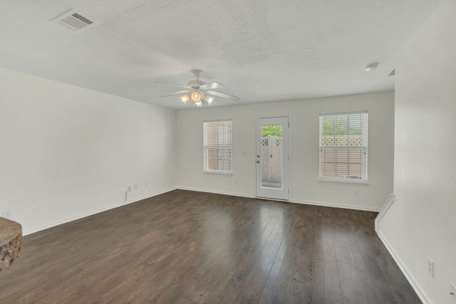 Open concept den with lots of light. Built in blinds in the back door as well as blinds in each of the windows will remain | Image 13