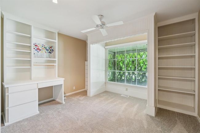 Unfurnished bedroom with light colored carpet and ceiling fan | Image 29