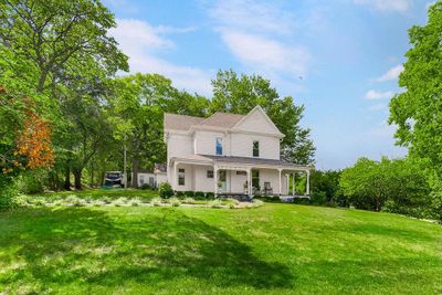 View of front of house featuring a front yard and a porch | Image 1