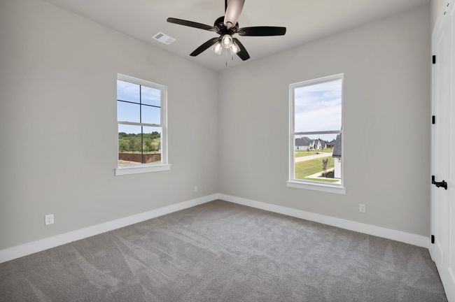 Carpeted spare room with baseboards and a ceiling fan | Image 27