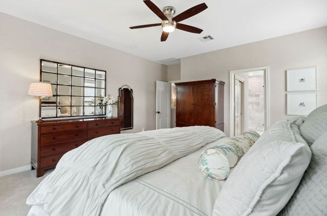The primary suite features plush Tempurpedic carpet and comes with its own deluxe ensuite bathroom and dual walk-in closets. | Image 22
