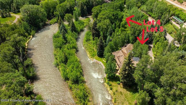 Lot 5 with home is in foreground; vacant Lot 4 is downriver. Island in river across from both lots. | Image 75