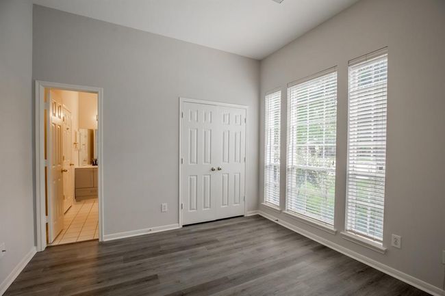 2nd bedroom - Bright room with large windows and laminate flooring. | Image 32