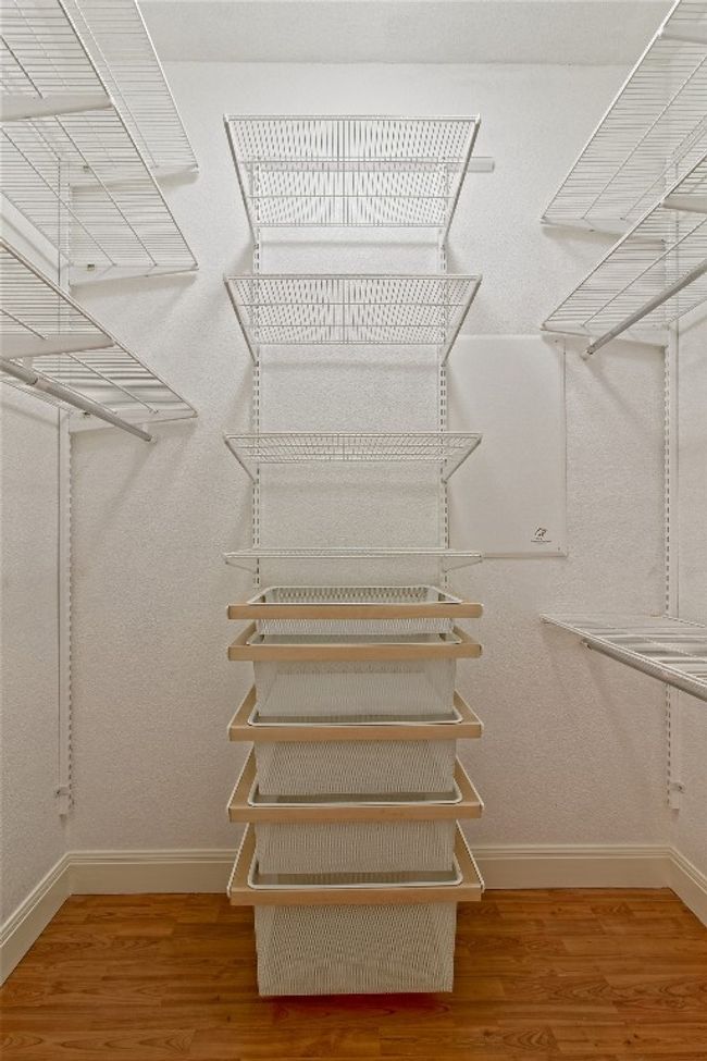 Walk in closet with wood finished floors | Image 22