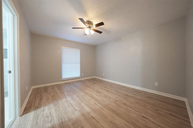 Spare room featuring ceiling fan, light wood-style flooring, and baseboards | Image 14