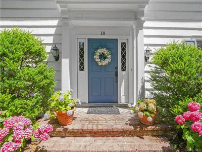 The front Door is highlighted by architectural details. | Image 2