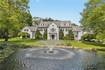 Gorgeous approach to the house overlooking the scenic pond and fountain | Image 3