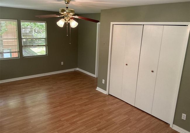 Discover the primary bedroom featuring convenient closet doors and easy access to the ensuite bath. | Image 6