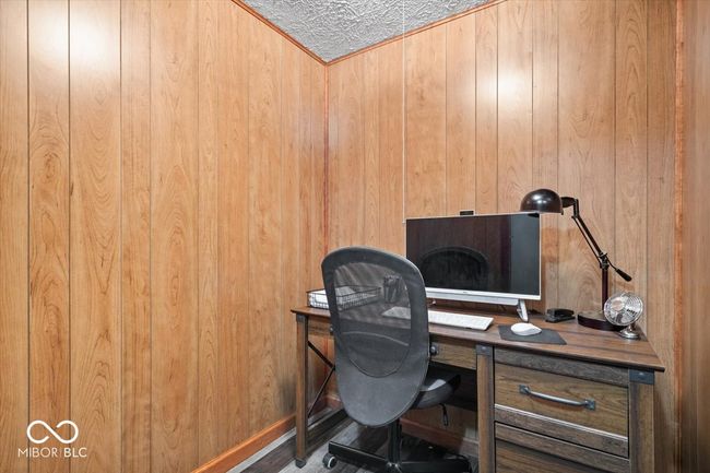 office area with wooden walls | Image 32