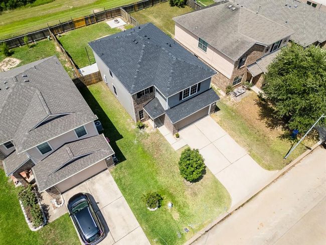 Two-story house offers spacious living with a well-designed layout for comfort and functionality. | Image 9