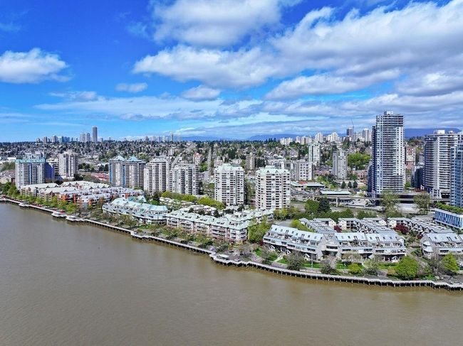 Bird's eye view of skyline and a large body of water | Image 31
