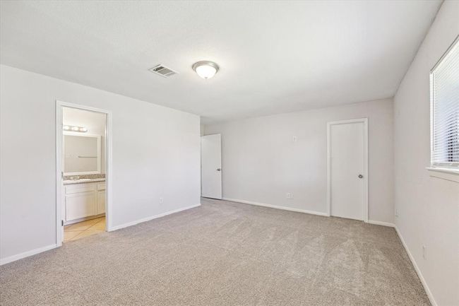 Second view of primary bedroom with en-suite bath. | Image 13