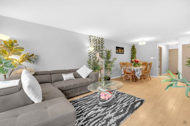 Living room with hardwood / wood-style floors and baseboards | Image 16