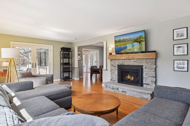 Hardwood floors, gas fireplace (new in 2022), and access to the porch are additional highlights of this space | Image 5