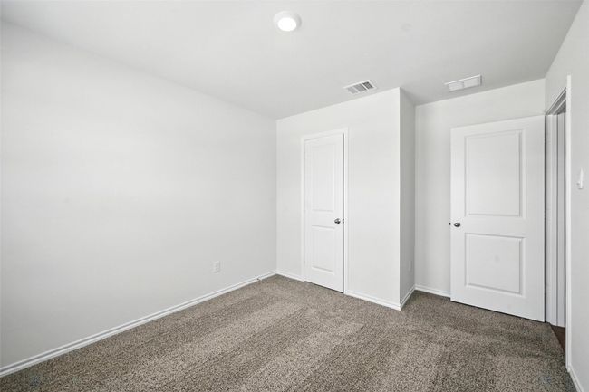 Unfurnished bedroom with carpet floors and baseboards | Image 13
