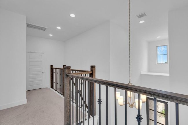 Corridor with recessed lighting, carpet, a chandelier, and an upstairs landing | Image 21