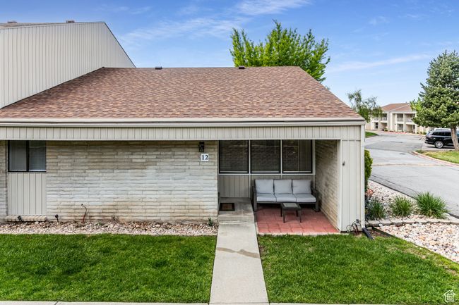 View of front of house with a shingled roof and a front lawn | Image 4