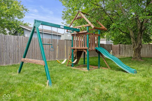 view of playground featuring a fenced backyard | Image 36