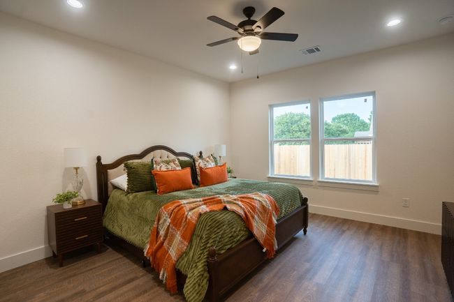 Bedroom with baseboards, dark wood-style flooring, recessed lighting, and ceiling fan | Image 15