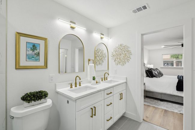 Ensuite bathroom featuring a sink, ensuite bath, visible vents, and double vanity | Image 14