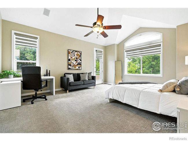 The large and private primary bedroom sits on its own level and has a west-facing balcony. | Image 8