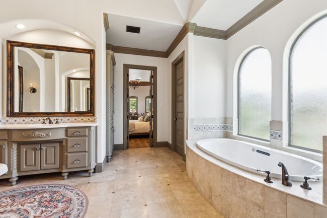 The Spa-Like Primary Bath Boasts a Kohler Hydrotherapy Spa Tub for Ultimate Relaxation | Image 19