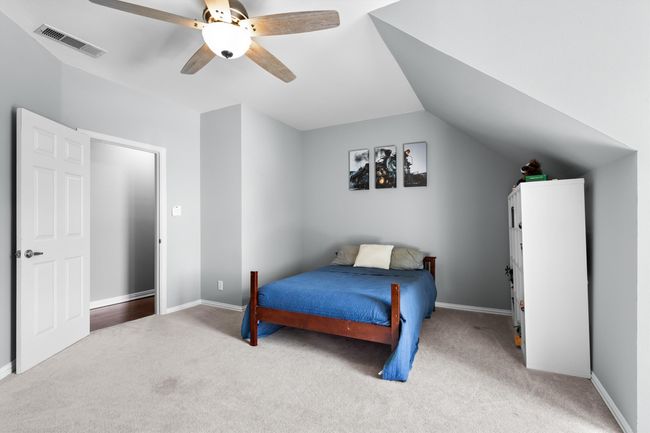 secondary bedroom upstairs with closet | Image 24