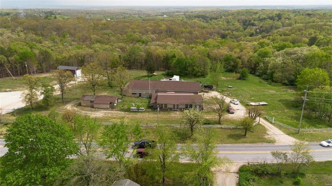 Bird's eye view featuring a forest view | Image 4