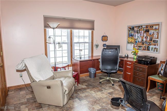 Office space with baseboards and stone finish flooring | Image 15