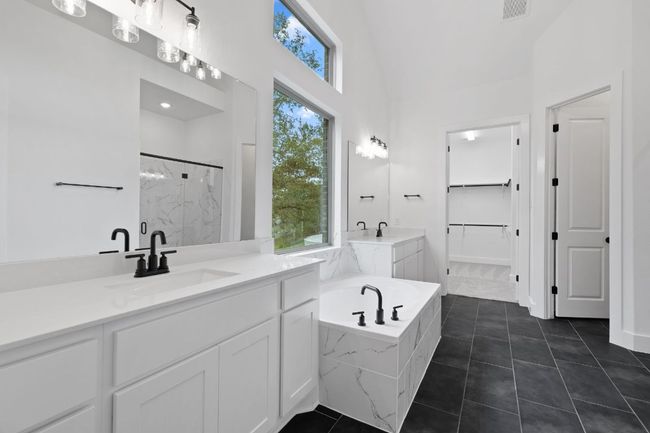 Primary Bath retreat with dual vanities & garden tub | Image 22