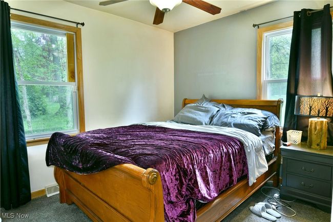 Bedroom featuring carpet floors and ceiling fan | Image 32