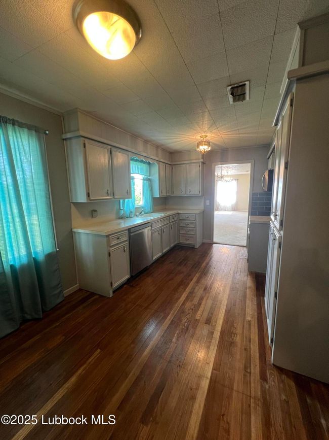 Kitchen has small table area. | Image 6