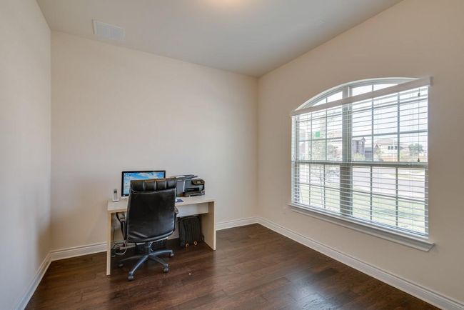 Home office with baseboards, wood finished floors, and visible vents | Image 6