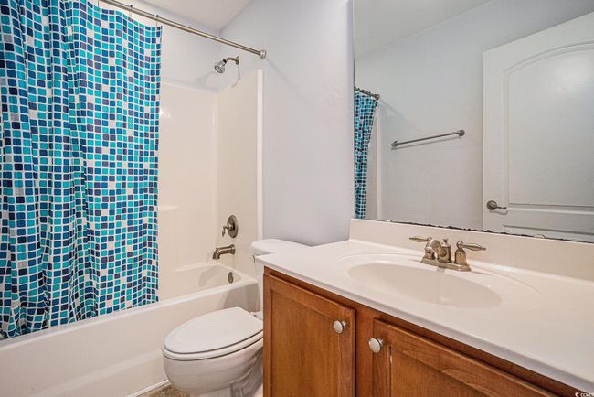 Full bath featuring shower / bath combo and vanity | Image 17