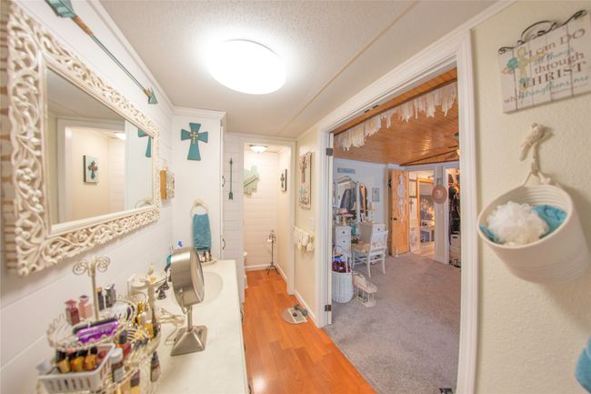 Bathroom featuring wood-type flooring and a textured ceiling | Image 10