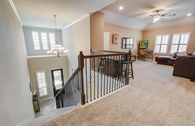 Wrought iron stair spindles leading to the game room. | Image 18