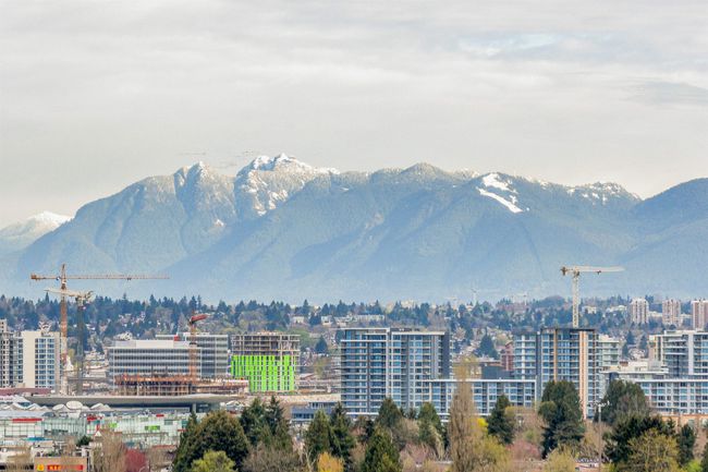 Mountain view featuring nearby urban area | Image 19