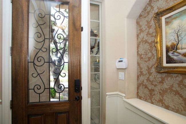 Foyer with wallpapered walls and healthy amount of natural light | Image 31