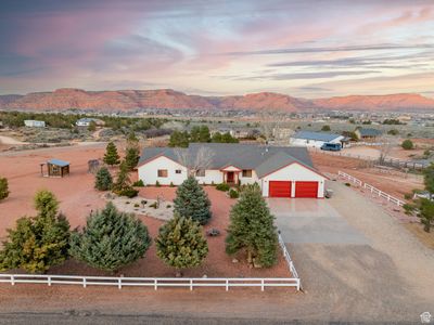 Aerial view at dusk featuring a mountain view | Image 1