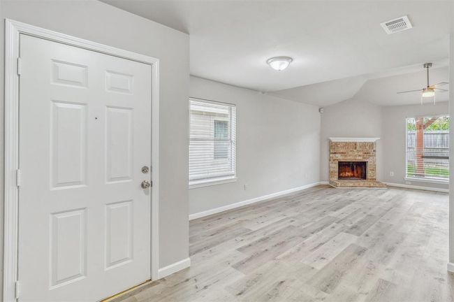 Welcome in! This light and bright interior features stylish luxury vinyl plank flooring, fresh neutral paint, and thoughtful updates throughout—creating a space that feels both modern and inviting. | Image 5