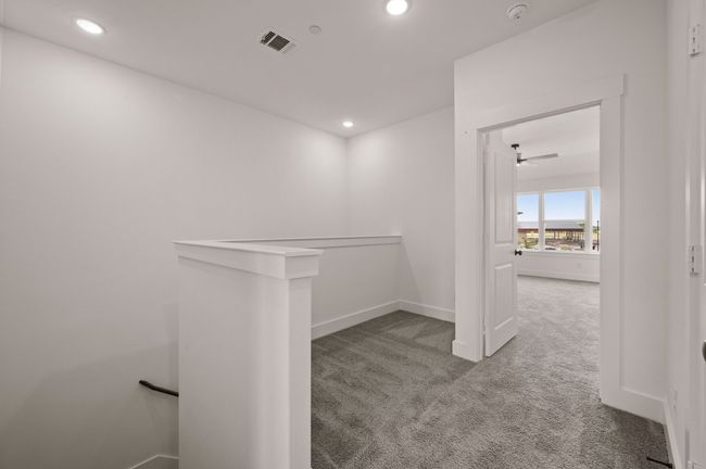 The loft at the top of the stairs makes a perfect pocket office or reading nook. | Image 10